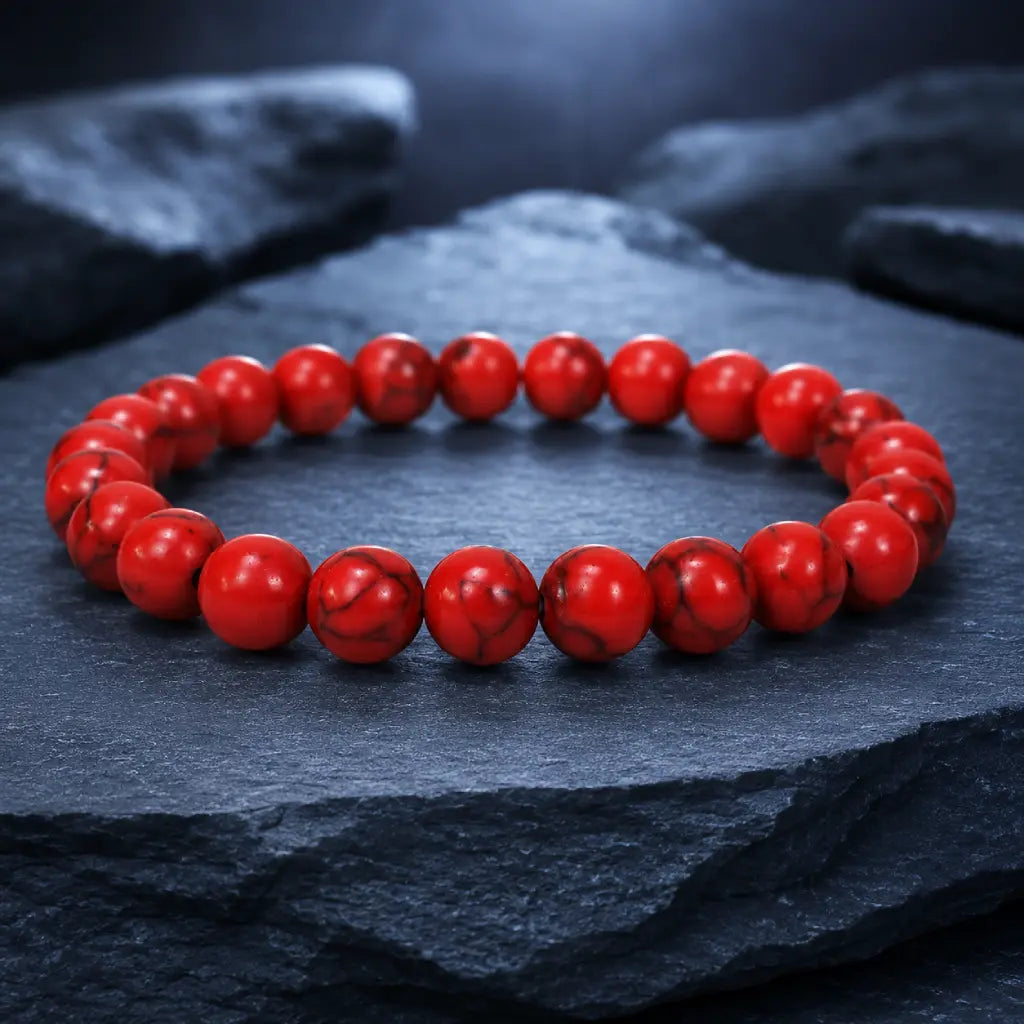 Red howlite bracelet featuring smooth crystal beads on dark stone styling for elegant meditation jewelry