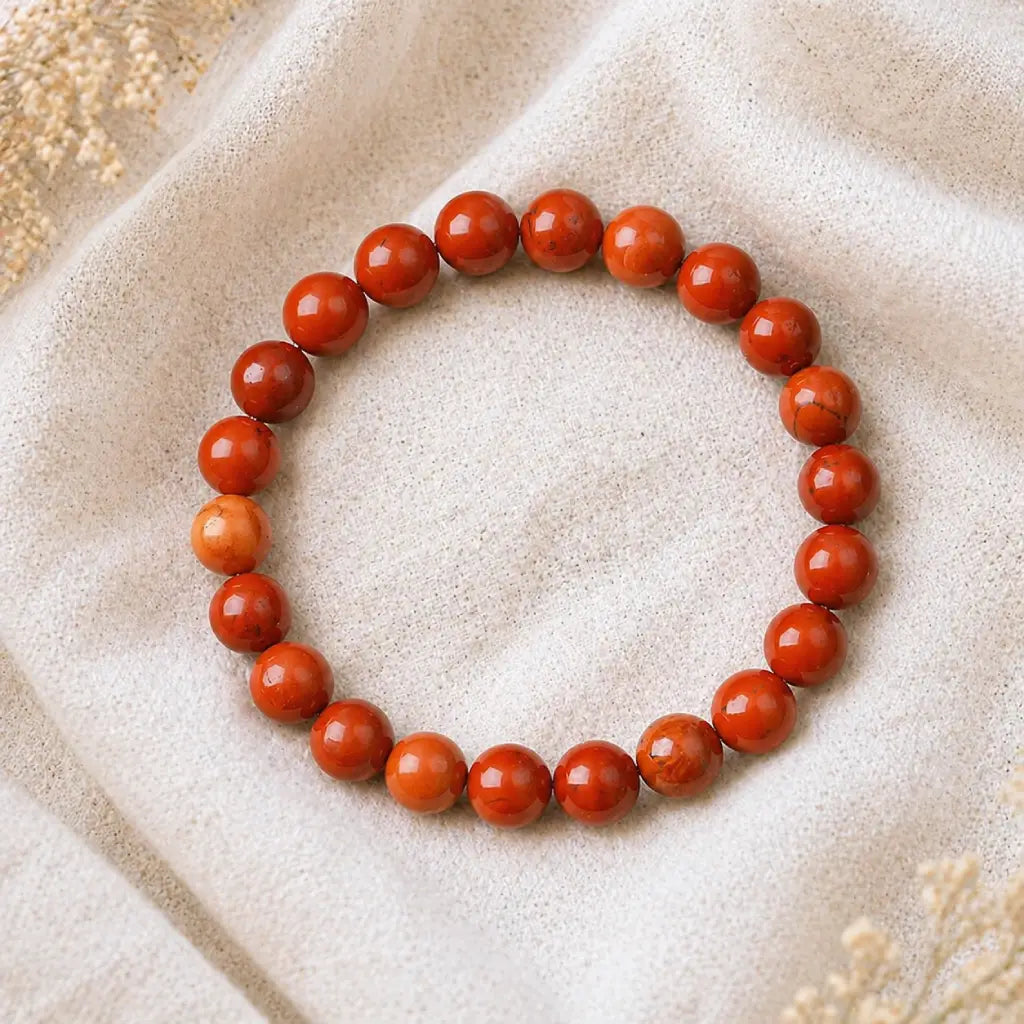 Red jasper stone bracelet shiny red bead stretch bracelet on linen with dried flowers, vibrant crystal gift idea