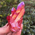 Red quartz crystal tower cluster featuring tall faceted points, vibrant raw gemstone specimen for collectors and elegant décor.