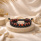 Red Tiger eye Bracelet with black lava stone beads and adjustable cord displayed as a stylish unisex jewelry accessory.
