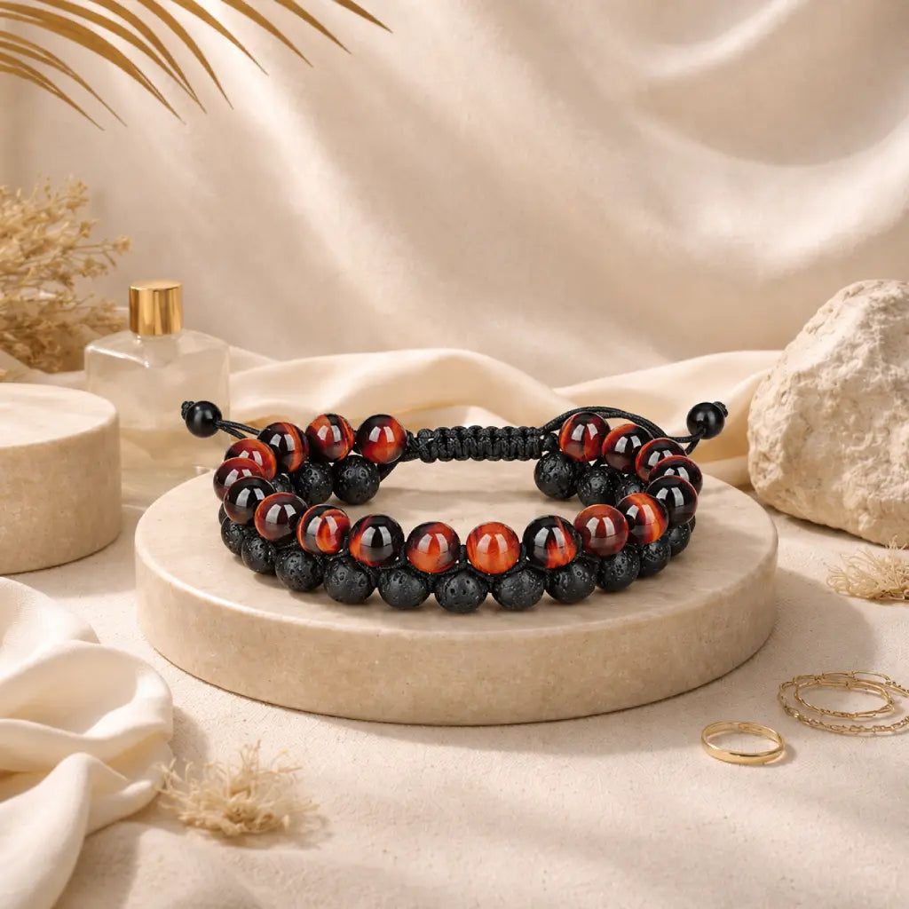 Red Tiger eye Bracelet with black lava stone beads and adjustable cord displayed as a stylish unisex jewelry accessory.