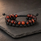 Red Tiger eye Bracelet with polished gemstone and black lava stone beads, featuring an adjustable cord for a refined look.