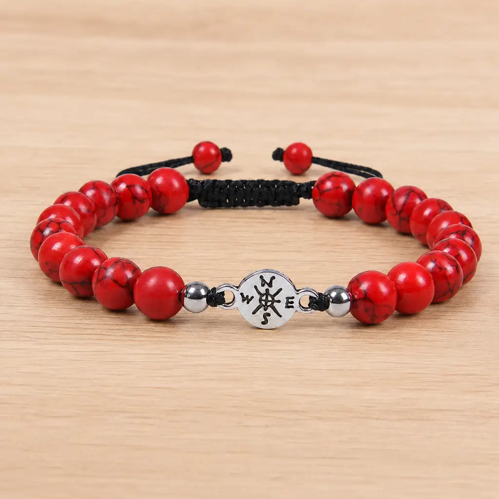 Red turquoise bracelet displayed on wood surface with polished stone beads for everyday fashion appeal