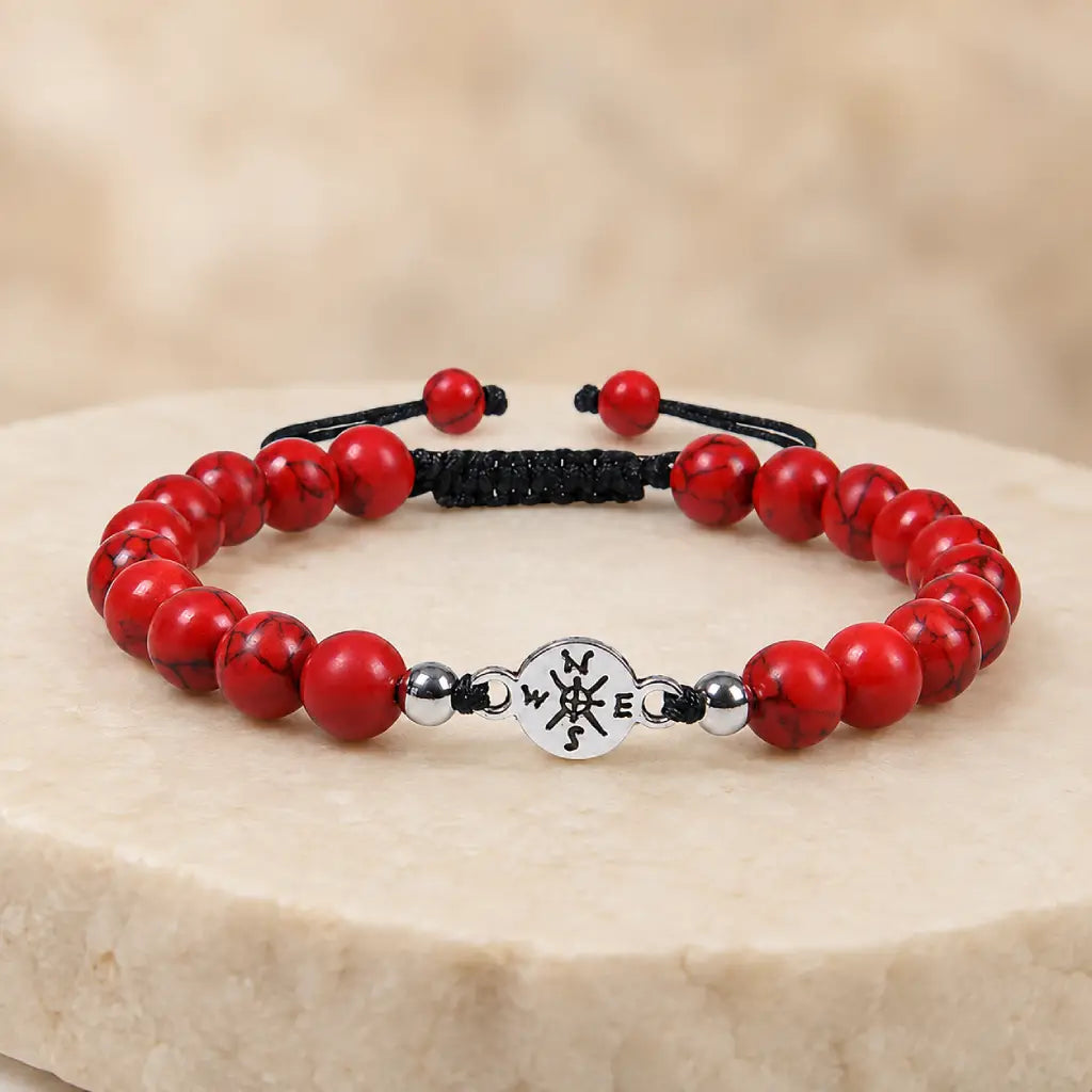 Red turquoise bracelet on neutral display stand with polished stone beads for elegant daily wear