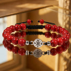 Red turquoise bracelet on reflective gold surface with polished gemstone beads for premium elegance