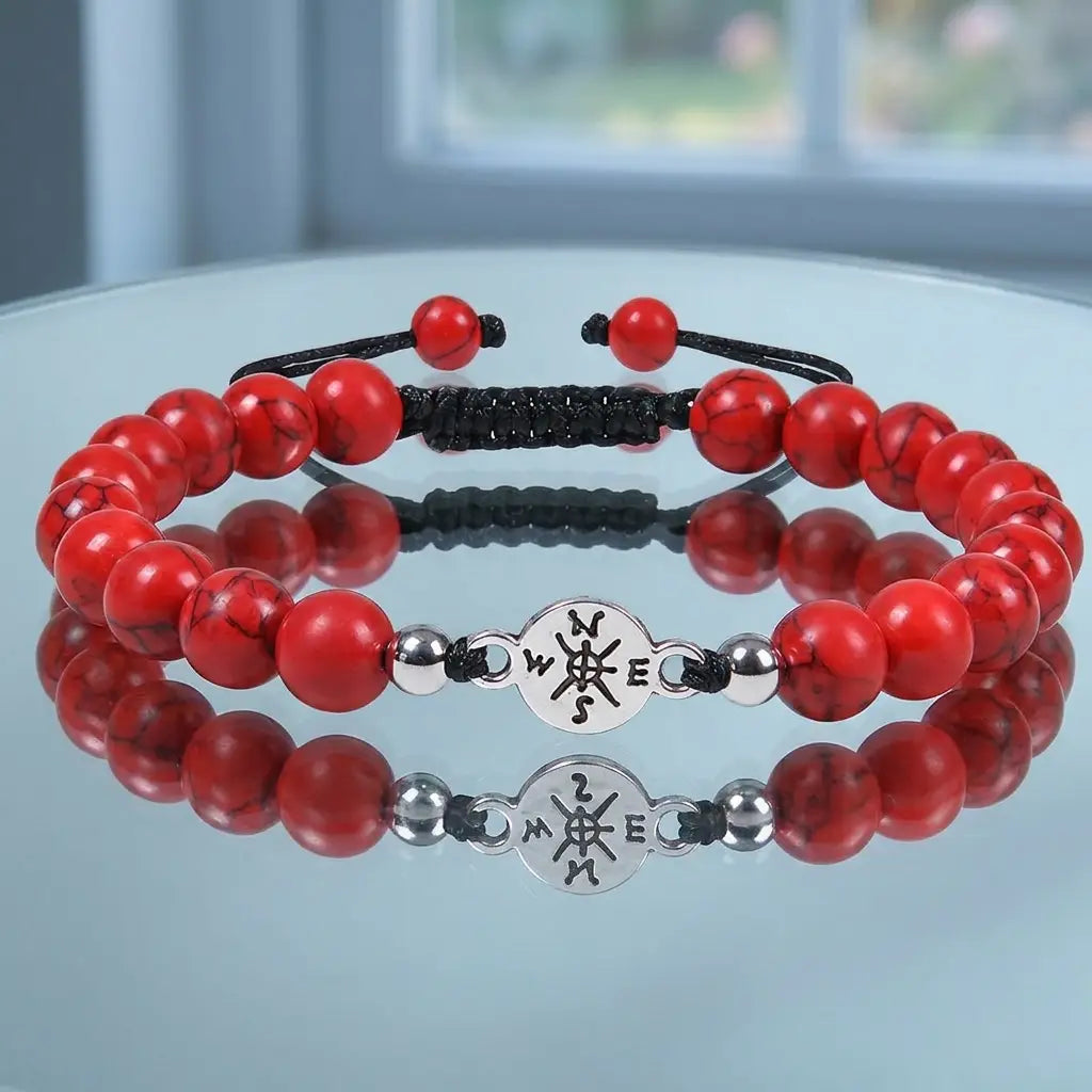 Red turquoise bracelet displayed on glass reflection surface with natural stone beads for modern appeal