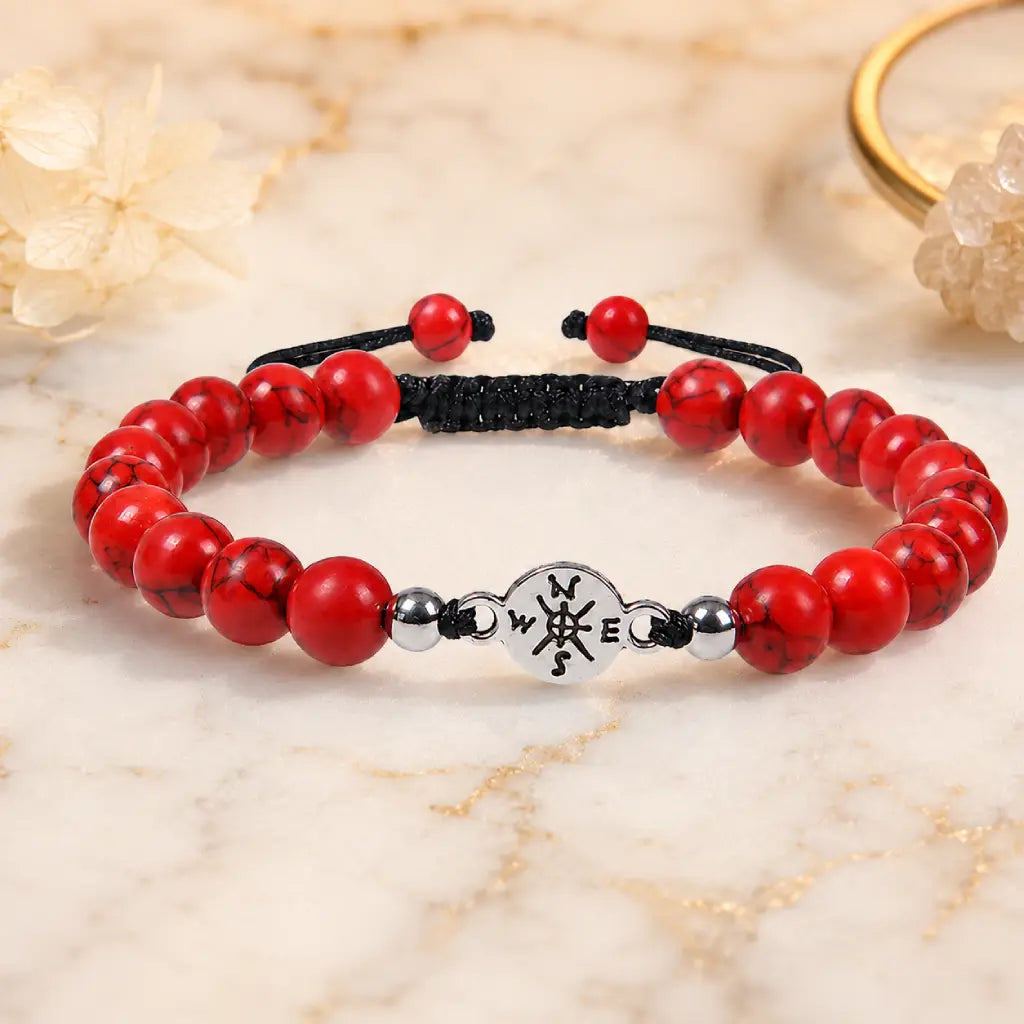 Red turquoise bracelet with vibrant gemstone beads on marble surface for refined accessory styling