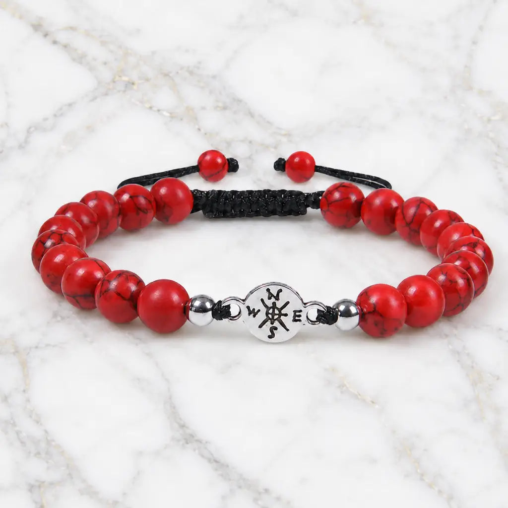 Red turquoise bracelet showcased on marble background with natural gemstone beads and modern appeal