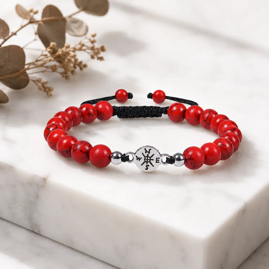 Red turquoise bracelet displayed with decorative accents for elegant gemstone jewelry presentation