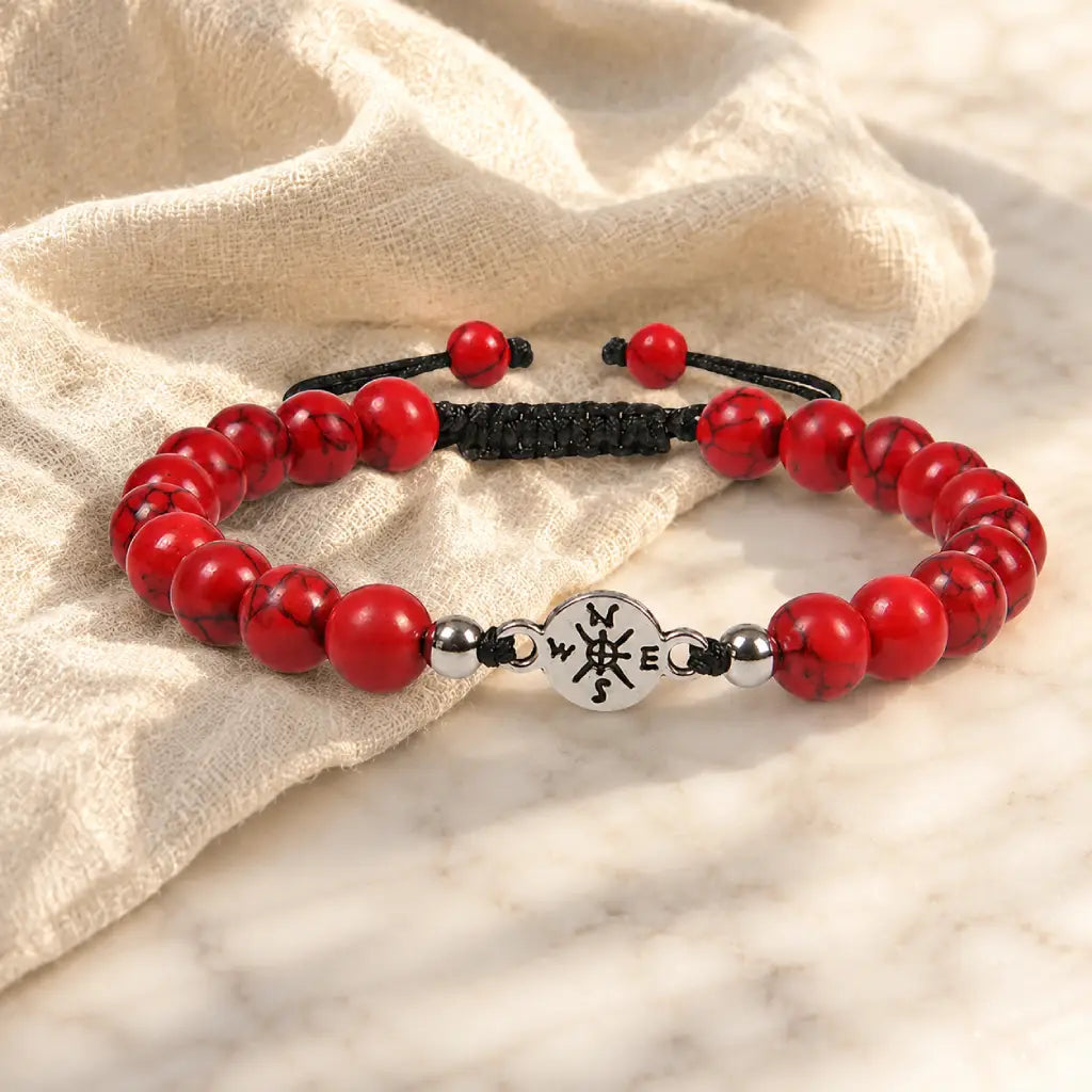 Red turquoise bracelet beside textured fabric with vibrant gemstone beads for stylish accessory appeal