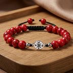 Red turquoise bracelet positioned on wooden tray with polished stone beads for modern fashion appeal