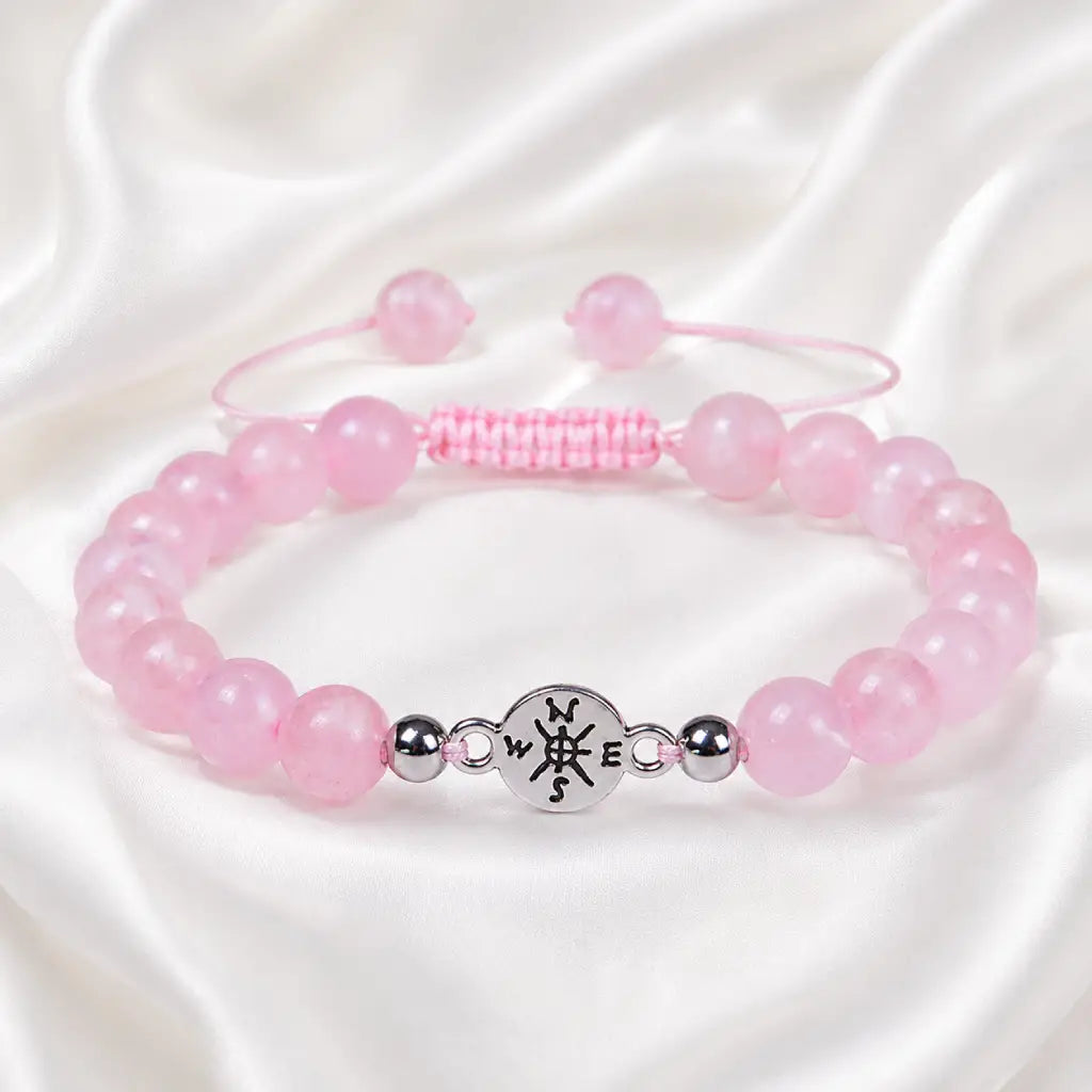Rose Quartz adjustable bracelet displayed on white silk fabric with polished crystals for elegant gifting daily