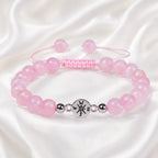 Rose Quartz adjustable bracelet displayed on white silk fabric with polished crystals for elegant gifting daily