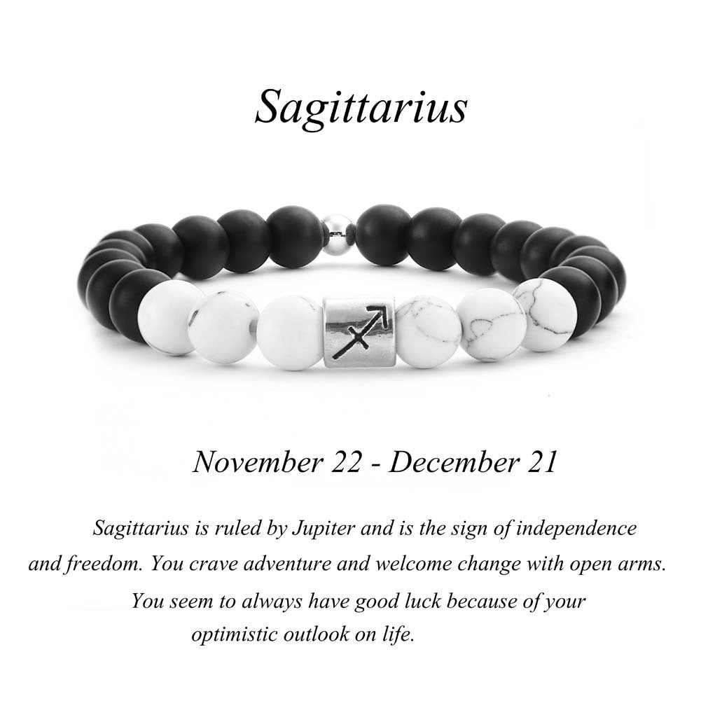Sagittarius zodiac bracelet with matte black Agate and white Howlite beads and a silver Sagittarius archer charm on white background