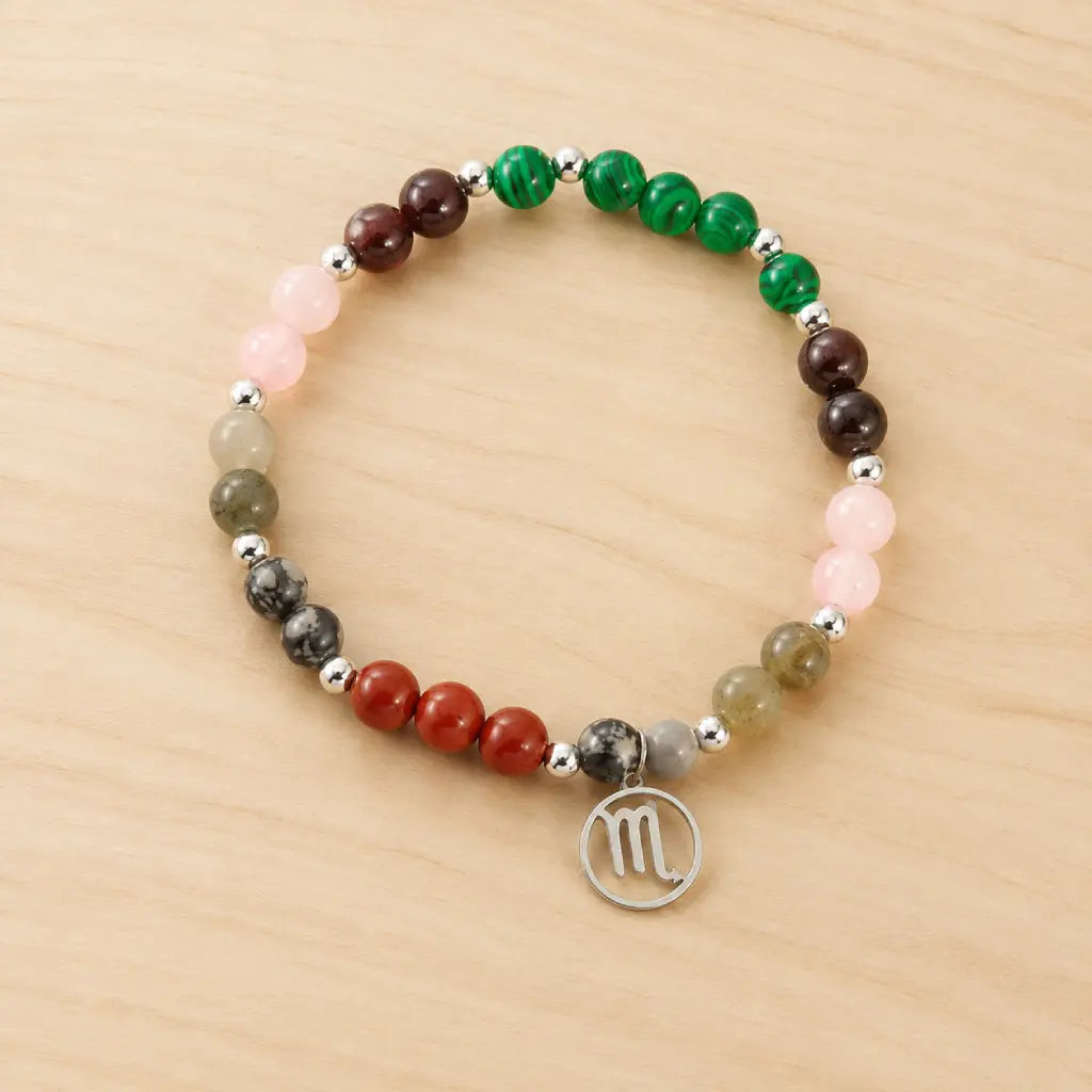 Scorpio crystal bracelet displayed on a wooden surface, handcrafted zodiac jewelry designed for horoscope enthusiasts