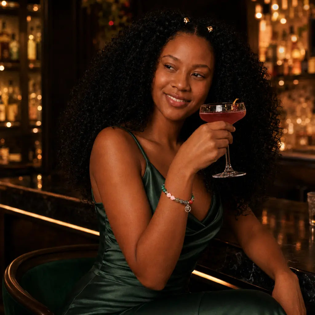 Scorpio crystal bracelet showcased with a cocktail dress, vibrant zodiac jewelry crafted for confident personal style