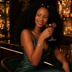 Scorpio crystal bracelet showcased with a cocktail dress, vibrant zodiac jewelry crafted for confident personal style