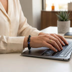 Scorpio Zodiac Bracelet worn while typing on laptop, unisex astrology jewelry enhancing focus, style, and daily productivity