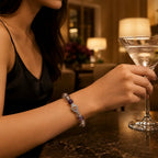 Woman holding a cocktail glass with a blurred background of a bar setting