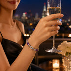 Woman holding a glass of champagne with a cityscape in the background
