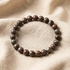 Snoflake bracelet glossy brown speckled beads on beige linen, earthy crystal jewelry for grounded everyday style
