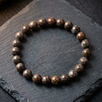Snoflake bracelet brown marbled beads on black slate tray, bold gemstone jewelry for masculine natural style