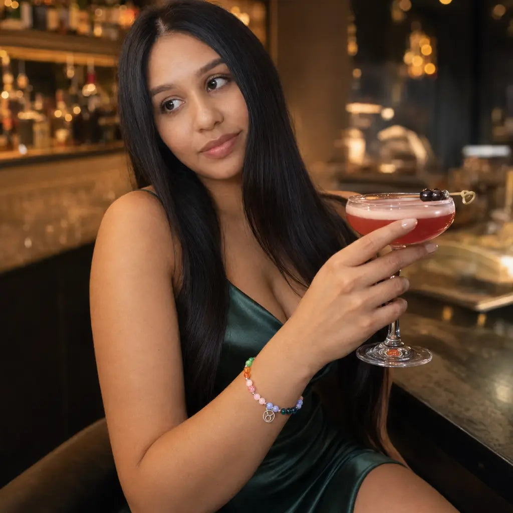 Taurus crystal bracelet paired with a cocktail dress and gemstone jewelry creating a sophisticated evening fashion statement