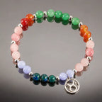 Taurus crystal bracelet captured in a reflective studio setting highlighting gemstone jewelry and zodiac charm details