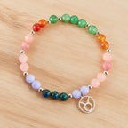 Taurus crystal bracelet displayed on a natural wood surface showcasing healing crystal jewelry and zodiac symbolism
