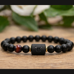 Taurus Zodiac Bracelet on wooden surface with black matte beads and tiger eye stone, natural astrology jewelry for grounding energy and calm