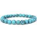 Turquoise beaded bracelet on a white background