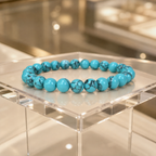 Teal howlite gemstone bracelet with smooth marbled beads displayed for elegant natural jewelry styling