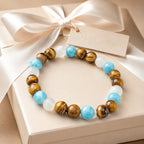 Tiger eye bracelet displayed with elegant ribbon gift packaging and crystal stone jewelry for memorable gifting