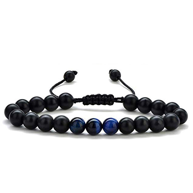 Tiger eye couple bracelets shown in a slim black and deep-blue bead style with polished round accents, matte black beads, and a black adjustable braided cord for direct comparison.