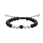 Tiger eye couple bracelets shown in a black and white coordinated strand with porous black beads, white marbled round accents, and adjustable braided cord in a balanced front view.