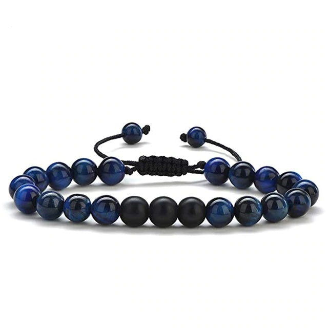 Tiger eye couple bracelets displayed in deep-blue and matte black round beads with two slim adjustable cord strands arranged together on a clean white background in one clear view.