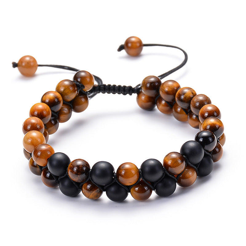 Tiger eye couple bracelets shown as a warm golden-brown and matte black double strand with polished round beads and a black braided adjustable closure for couples or close friends.