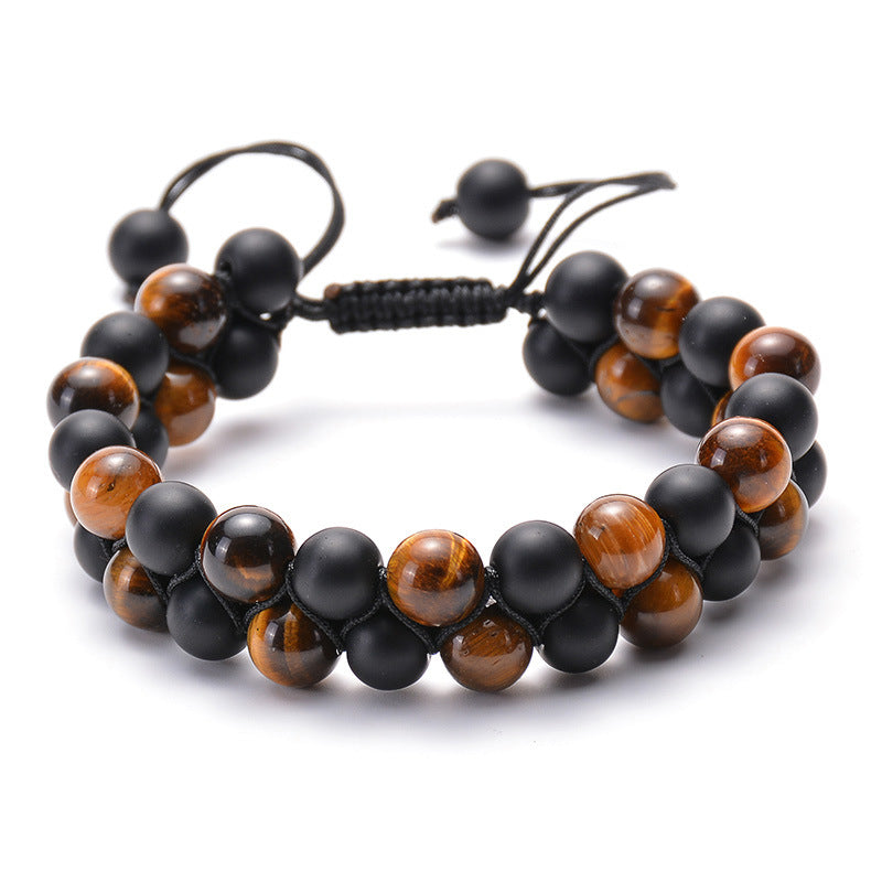 Tiger eye couple bracelets arranged as a double-row style with matte black round beads, polished golden-brown striped beads, and adjustable black cord ends in a clear product view.