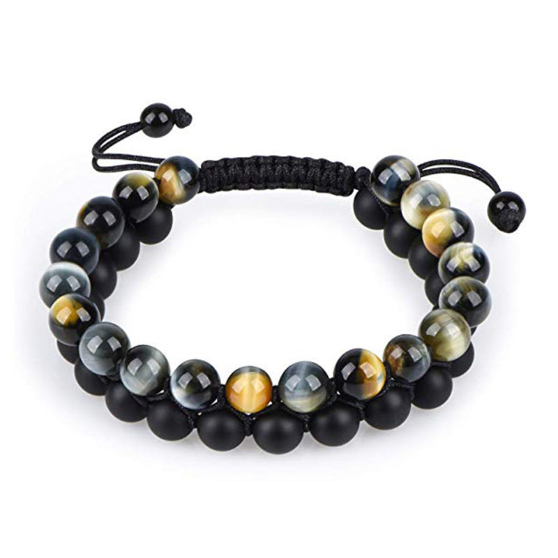 Tiger eye couple bracelets shown as a double-wrap pair with golden-brown, gray-striped, and matte black round beads joined by a black adjustable braided cord on a plain background.