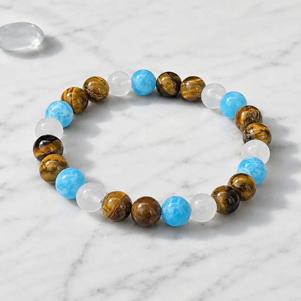 Tiger eye bracelet presented on marble surface with natural crystal jewelry for modern premium style