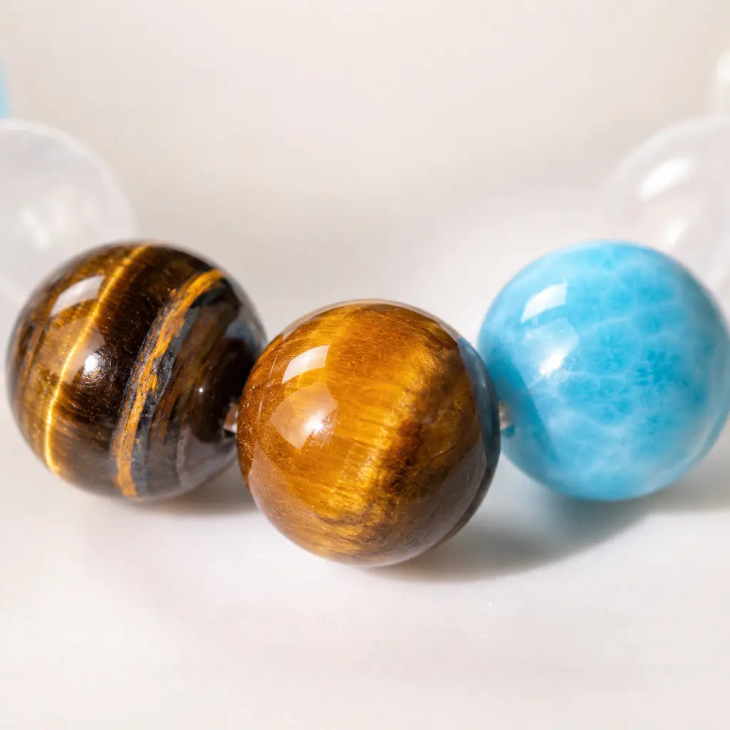 Tiger eye bracelet macro view showing natural gemstone beads with polished crystal jewelry brilliance
