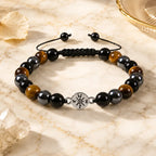 Tigereye bracelet featuring polished brown stones and black beads for grounding energy style