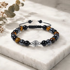 Tigereye bracelet with natural gemstone beads and sleek black accents for refined style appeal