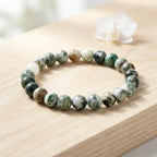 Tree stripe agate bracelet polished green bead bracelet on wood with white flower, natural crystal jewelry gift look