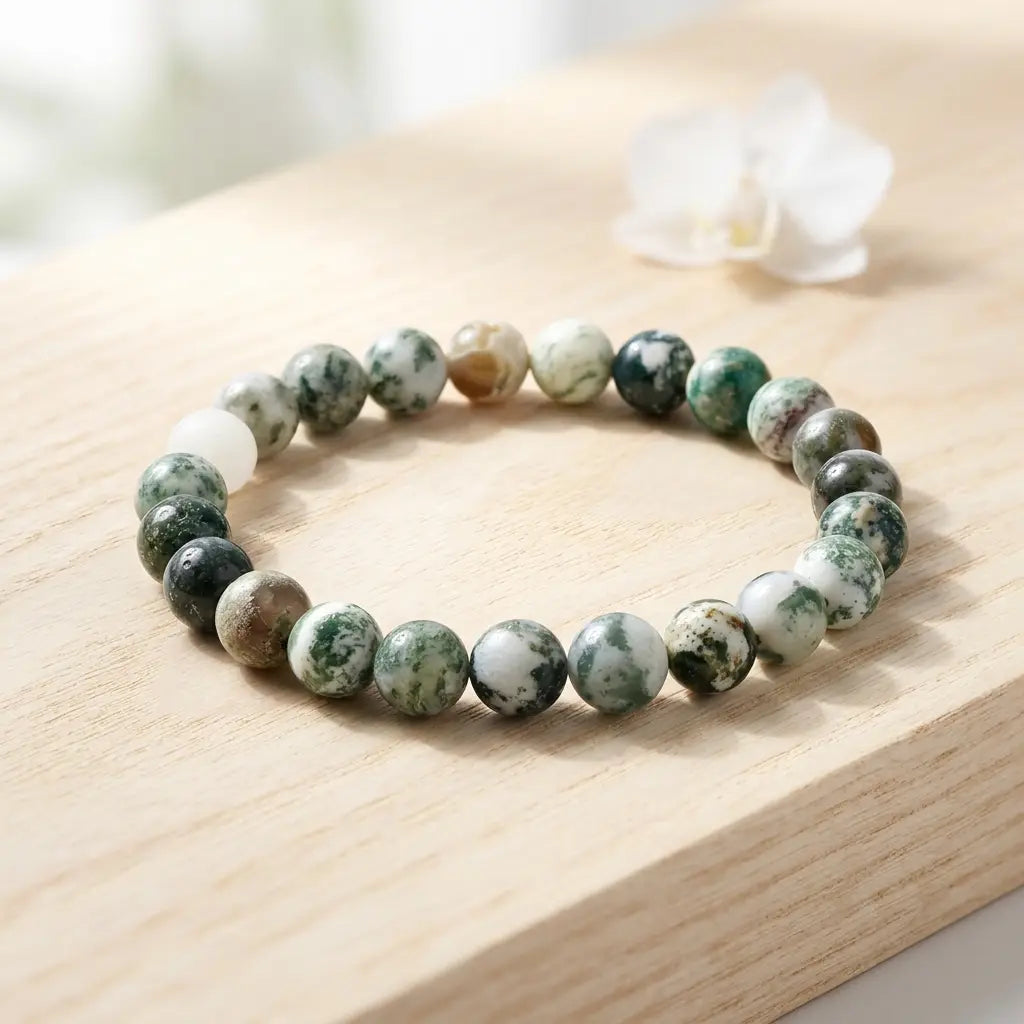 Tree stripe agate bracelet polished green bead bracelet on wood with white flower, natural crystal jewelry gift look