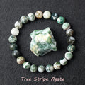 Tree Stripe Agate bracelet with mossy green and white beads, believed to represent grounding and natural abundance