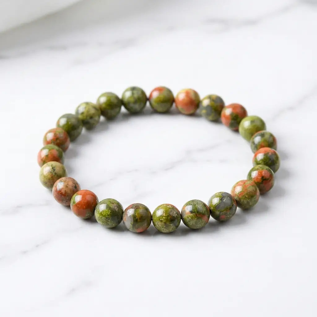Unakrite stone bracelet glossy green orange bead bracelet on white marble, earthy gemstone jewelry daily wear look