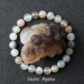 Agate bracelet with a crystal on a dark background
