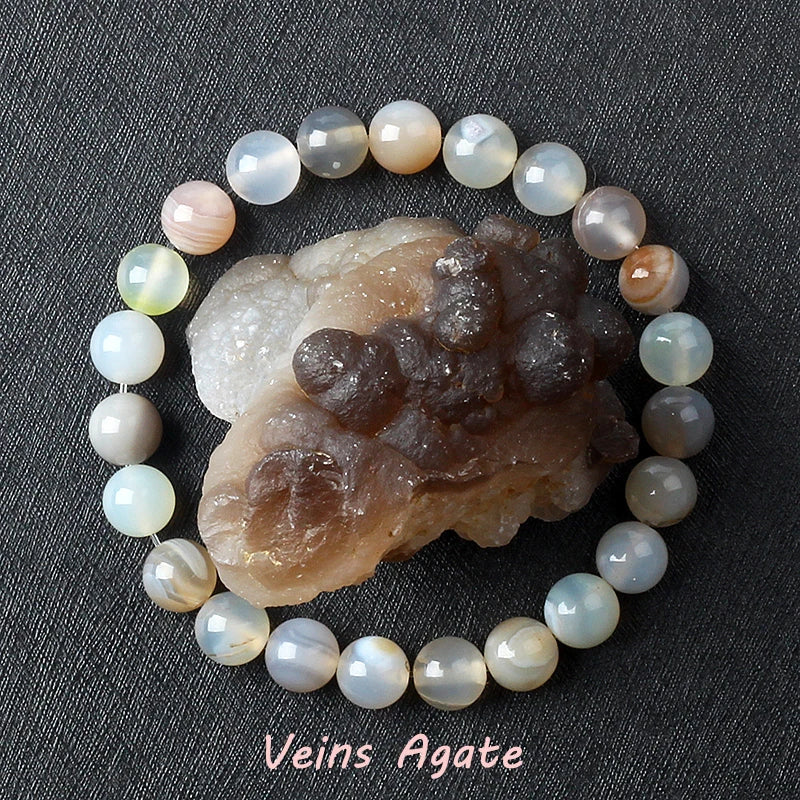 Agate bracelet with a crystal on a dark background