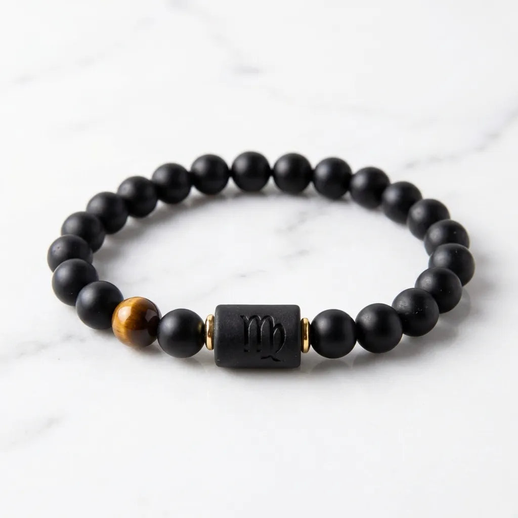 Virgo zodiac bracelet on white marble with black beads and tiger eye accent for clean minimalist product display appeal